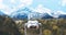 Touristic telescope look at the city with view snow mountains, metal binocular on background viewpoint observe vision, closeup