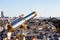 Touristic telescope overlooking Paris from the roof of Printemps Department Store