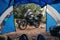 In a touristic tent. First-person view. Camping on a motorcycle. Motobike for long journeys is in the center of the frame. The