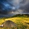 Touristic tent and storm clouds