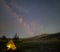 Touristic tent under a starry sky with milky way