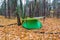 Touristic tent under a tarp in a forest