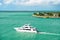 Touristic yacht floating near green island at Key West, Florida