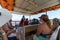 Tourists aboard a catamaran ride on Carneiros beach