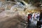 Tourists admire the cave frescoes at Sigiriya Rock Fortress.