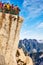 Tourists admire scenic view from Huashan mountain.