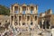 Tourists admiring ancient Greek and Roman Library Of Celsus at E