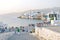 Tourists along Mykonos waterfront overlook little Venice