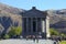 Tourists at Ancient hellenistic Garni pagan Temple in Armenia