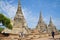 Tourists at the ancient stupas of the Buddhist temple Wat Phra Si Sanphet. Ayutthaya, Thailand