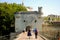 Tourists approaching the gatehouse on the bridge Pont Saint-BÃ©nÃ©zet at Avignon on the river Rhone