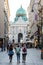 Tourists approaching the imperial Hofburg palace in Vienna