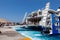 Tourists arriving to Santorini\'s port from iOS on board catamaran super ferry.