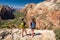 Tourists with backpack hiking in Zion