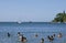 Tourists bathing on a summer day at Laranjeiras beach, Balneario de Camboriu, Santa Catarina Brazil - February 02, 2019.