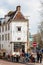 Tourists at a beautiful coffee shop at Old Central district on a freezing early spring day in Amsterdam