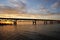 Tourists beautiful watching sunset under Mackinac Bridge by Lake Michigan near Mackinaw City