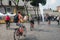 Tourists biking in Rome Via dei Fori Impaeriali