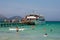 Tourists boarding off a cruise ship at Playa de Muro beach in Alcudia bay