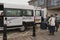 Tourists boarding a shuttle bus on the Scilly Isles, UK