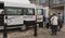 Tourists boarding a shuttle bus on the Scilly Isles, UK