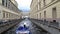Tourists boat cruising at the narrow channel of Neva river near Hermitage in Saint Petersburg