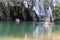 Tourists on boat at the entrance of the Underground River, one of the new Seven Wonders of the nature