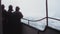 Tourists in a boat navigating the turbulent waters of Niagara Falls