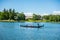 Tourists boating at the center of the Great Pond,The Catherine Palace , a Rococo palace, the summer residence of the Russian tsars