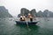 Tourists on boats in Halong Bay