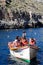 Tourists with bouyancy aids at Blue Grotto, Malta.