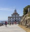 Tourists at the Cape Finisterre Lighthouse on the coast of Galicia, Spain.