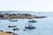 Tourists, caravans and boats on Kamenjak peninsula by the Adriatic sea in Premantura, Croatia.