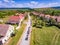 Tourists in cariages with horses traveling trough Mesendorf Saxon Village in the summer