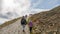 Tourists with child on the trail in the Karkonosze Mountains, Sniezka summit 1603 m n.p.m., Poland, Karkonosze National Park, Tour
