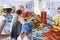 Tourists choose necklaces from lava in Sicily