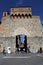 Tourists at the city gate of San Gimignano in Italy