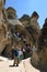 Tourists climb into a fairy chimney at Pasabagi.