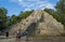 Tourists are climbing on the highest pyramid of Yucatan