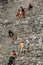 Tourists climbing a Mayan pyramid in Mexico