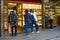 Tourists are considering jewelry in shop windows on the Golden Bridge, Florence