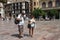 Tourists at Constitution square in the Spanish seaside city of Malaga