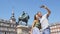 Tourists couple taking selfie using smart phone in Madrid Spain on Plaza Mayor