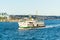 A tourists cruise ship sailing on the Bosphorus Strait of Istanbul of Turkey, part of the continental boundary between Europe and