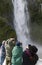 Tourists on the cruising boat approaching Stirling Falls , Milford Sound, Fiordland, South Island of New Zealand