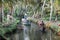 Tourists cruising on a canoe a river of the backwaters at Kollam