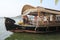 Tourists cruising on a houseboat a river of the backwaters at Ko