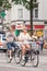 Tourists cycling at Dam square, Amsterdam, Netherlands