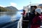 Tourists on the deck of the ship `Pioneer of Altai` watch the views of Lake Teletskoye. Altai Republic