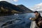 Tourists on the deck of the ship `Pioneer of Altai` watch the views of Lake Teletskoye. Altai Republic